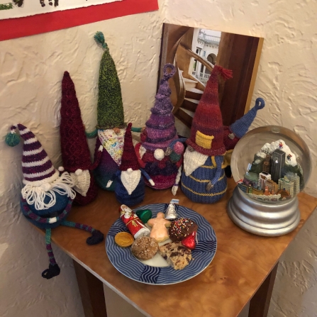 Knitted gnomes admiring the cookie selection